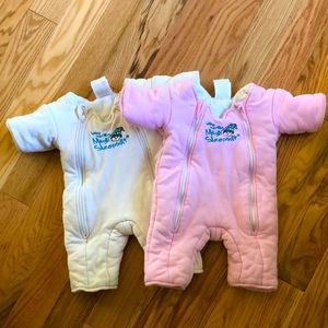2 Magic Merlin sleepsuits, size small, one pink and one off white.